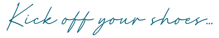 the words kick off your shoes in cursive